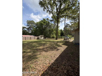 Charming 3-bedroom, 1.5-bath brick home situated on nearly half - photo 13