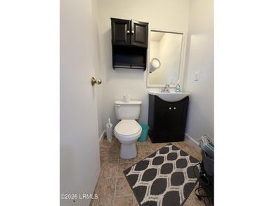 Charming 3-bedroom, 1.5-bath brick home situated on nearly half - photo 21