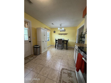 Charming 3-bedroom, 1.5-bath brick home situated on nearly half - photo 32
