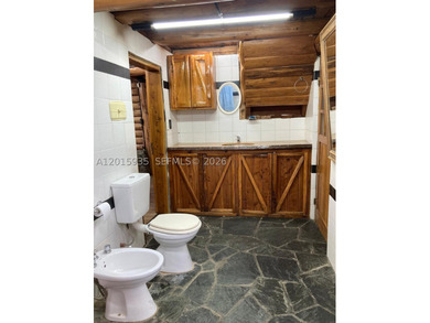 Exceptional handcrafted log home built with solid cypress logs - photo 29