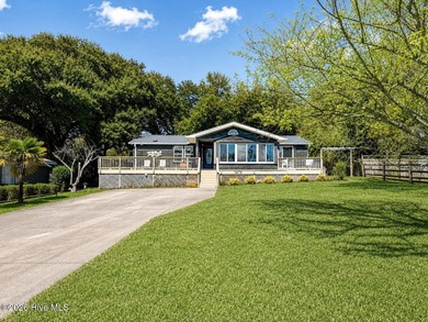 * BACK ON MARKET at no fault of seller * Tucked away on the - photo 1