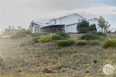 Perched above the city on 1.09 acres, 1428 Rawhide Strip is the - photo 3