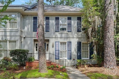 Tucked into a walkable enclave of town, this two-story townhome - photo 3