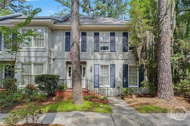 Tucked into a walkable enclave of town, this two-story townhome - photo 4