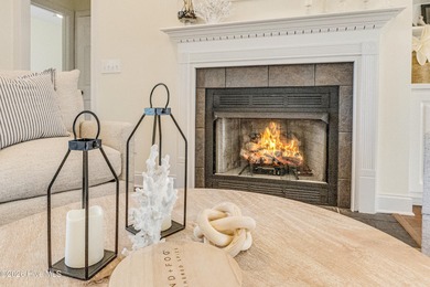 This elegant all-brick, one-level home is perfectly situated in