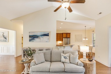 This elegant all-brick, one-level home is perfectly situated in