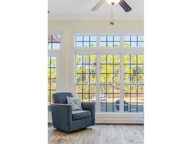 This elegant all-brick, one-level home is perfectly situated in