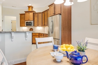 This elegant all-brick, one-level home is perfectly situated in