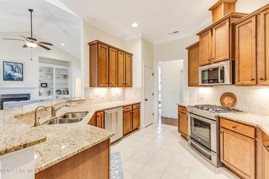 This elegant all-brick, one-level home is perfectly situated in