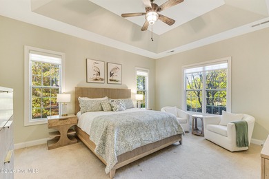 This elegant all-brick, one-level home is perfectly situated in