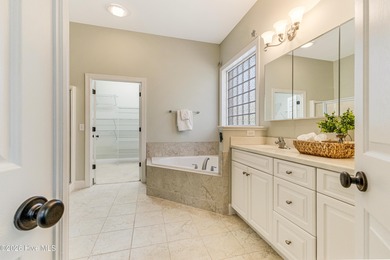 This elegant all-brick, one-level home is perfectly situated in