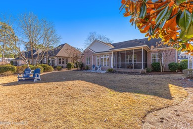 This elegant all-brick, one-level home is perfectly situated in
