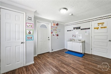 Property set up as a daycare facility. Features classrooms, a - photo 8
