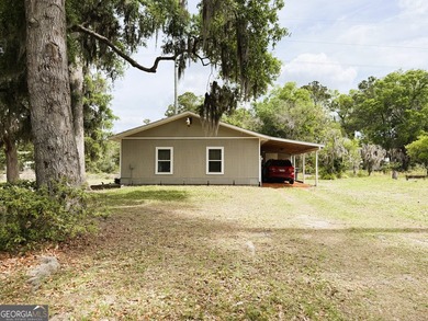CHARMING TWO-BEDROOM EFFICIENCY COTTAGE TUCKED AWAY ON OVER A - photo 1