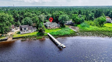 Experience luxurious riverfront living in this fully renovated - photo 49