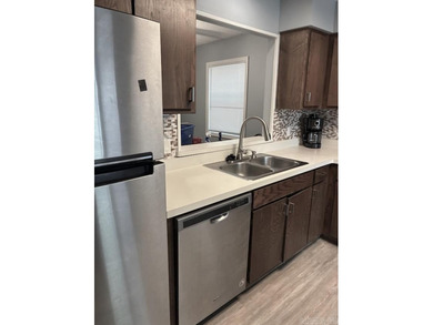Great Location! This unique single level end unit townhome has - photo 13