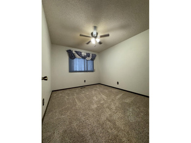 Welcome to 909 Crescent Drive in Ness City, where space, comfort - photo 23