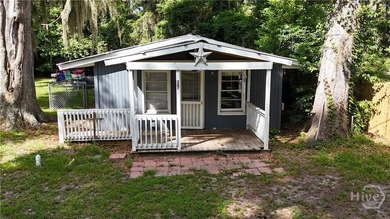 Welcome to this two bedroom, one bath home nestled on a generous - photo 3