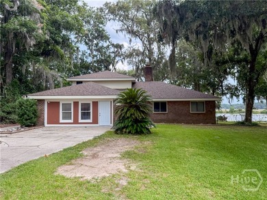 Well-built and well-maintained, this 4-bedroom, 2-bath lakefront - photo 1