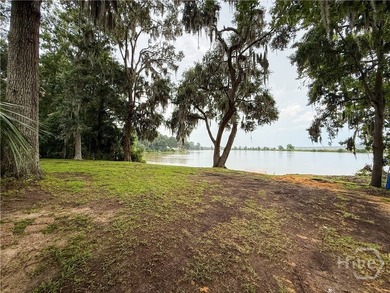 Well-built and well-maintained, this 4-bedroom, 2-bath lakefront - photo 2