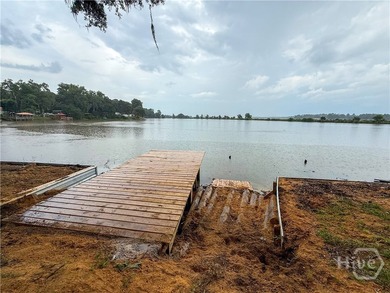 Well-built and well-maintained, this 4-bedroom, 2-bath lakefront - photo 3