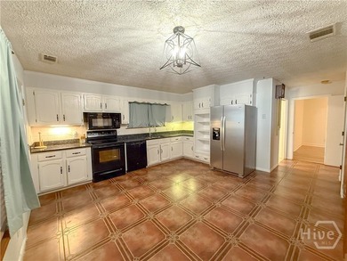 Well-built and well-maintained, this 4-bedroom, 2-bath lakefront - photo 5