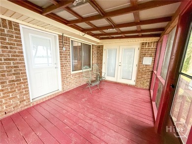 Well-built and well-maintained, this 4-bedroom, 2-bath lakefront - photo 7