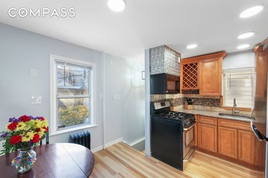 Bathed in natural light from its northeast exposure, this - photo 4