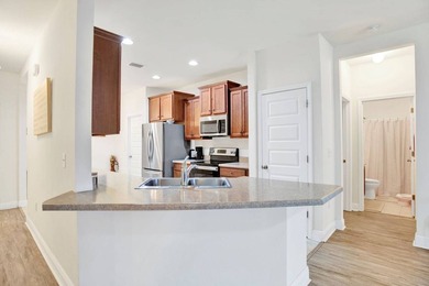 Located in the gated community of Cypress Gates, this GOLD - photo 11