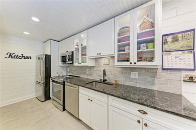 Imagine maintenance-free vacation living. This charming - photo 11