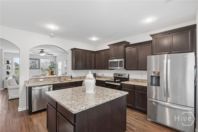 The heart of this this meticulously maintained 5-bedroom - photo 9