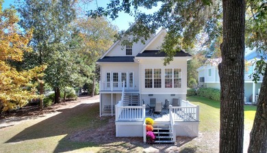 This charming lakefront cottage has new HVAC units and was built - photo 4
