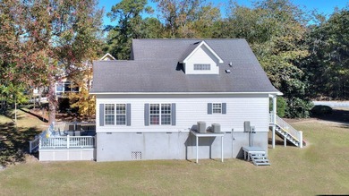 This charming lakefront cottage has new HVAC units and was built - photo 9