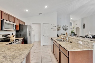 This charming 3-bedroom, 2-bath home offers a spacious open - photo 16