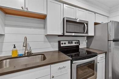 This adorable furnished condo has been remodeled and is in - photo 9