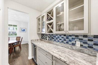 Situated on a premium pond lot, this stunning home is located - photo 11