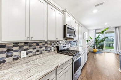 Situated on a premium pond lot, this stunning home is located - photo 12