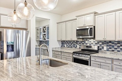 Situated on a premium pond lot, this stunning home is located - photo 13