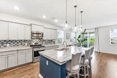 Situated on a premium pond lot, this stunning home is located - photo 14