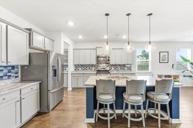 Situated on a premium pond lot, this stunning home is located - photo 15