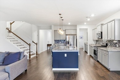 Situated on a premium pond lot, this stunning home is located - photo 17