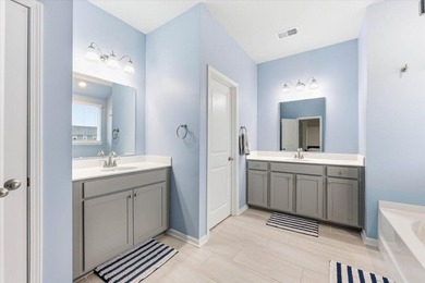 Situated on a premium pond lot, this stunning home is located - photo 28