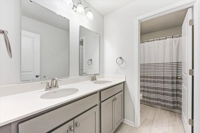 Situated on a premium pond lot, this stunning home is located - photo 36