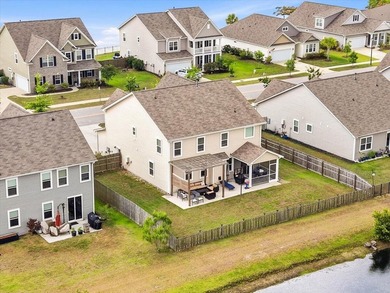 Situated on a premium pond lot, this stunning home is located - photo 44