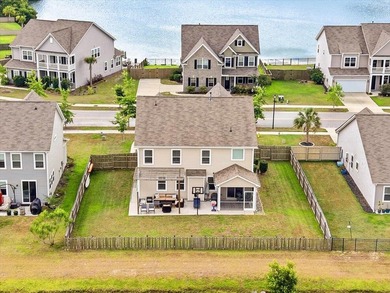 Situated on a premium pond lot, this stunning home is located - photo 46