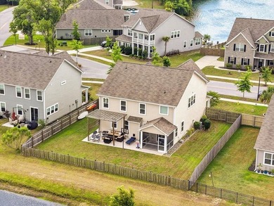 Situated on a premium pond lot, this stunning home is located - photo 48