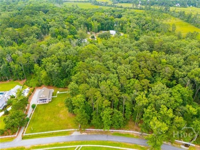 Nestled among majestic live oaks and the natural beauty that - photo 3