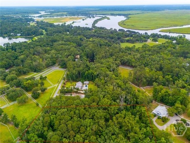 Nestled among majestic live oaks and the natural beauty that - photo 8