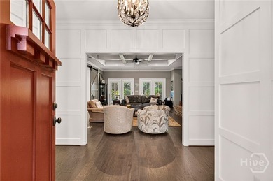 Nestled beneath majestic Live Oaks in the sought-after gated - photo 3