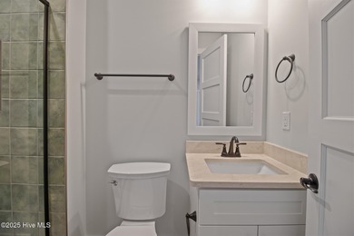 Experience refined coastal living in the heart of Emerald Isle